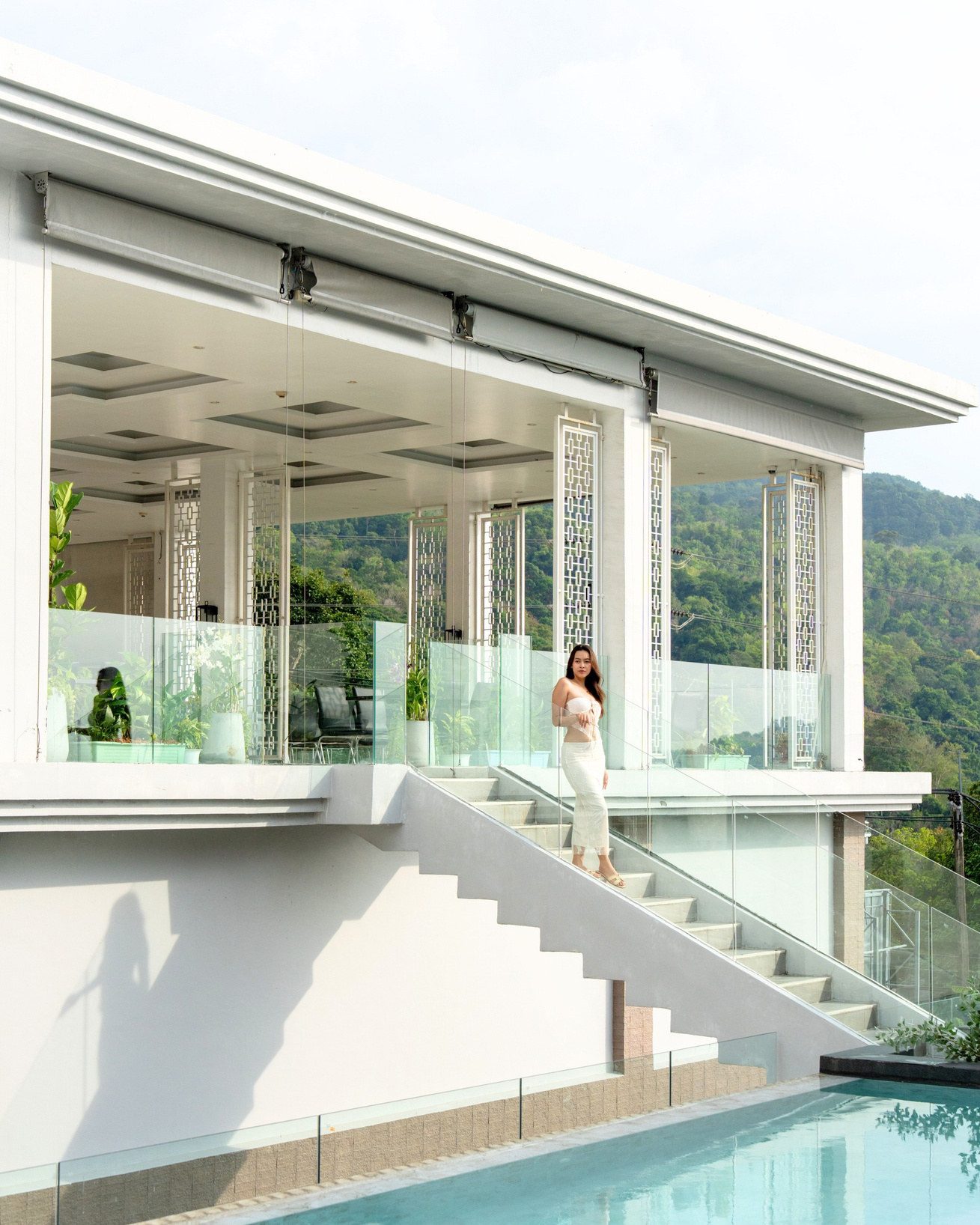 Resident enjoying the poolside sea view