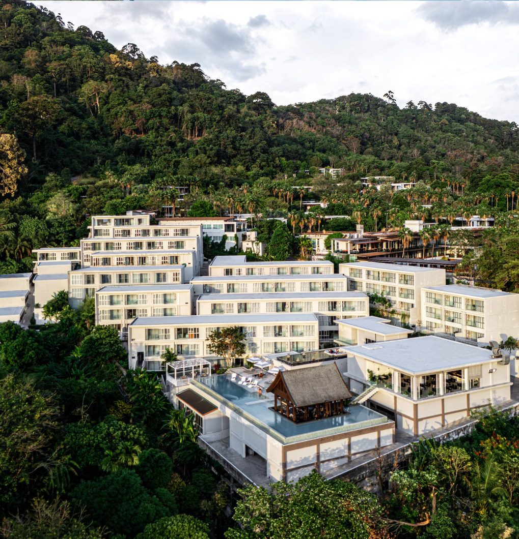 Daytime aerial view of the SEAVALE Patong low-rise residences surrounded by tropical hills