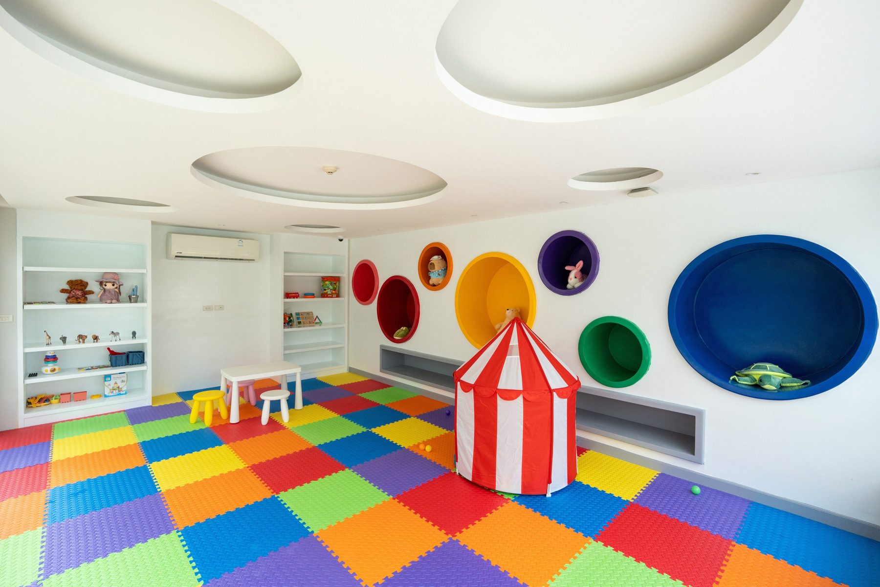 Indoor kids club with colourful play flooring